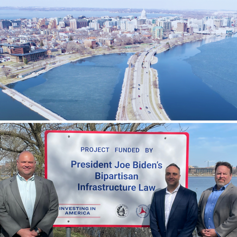 rial view of John Nolen Drive and the Madison shoreline featuring Monona Terrace on top with photo of KL staff by Biden sign below.