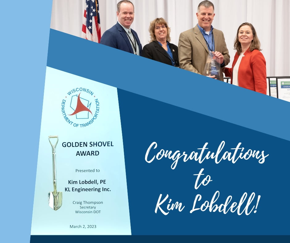 Angular blue block design with image of Golden Shovel award, photo at top of Scott Cramer accepting award on Kim's behalf, and "Congratulations to Kim Lobdell!" in script text.