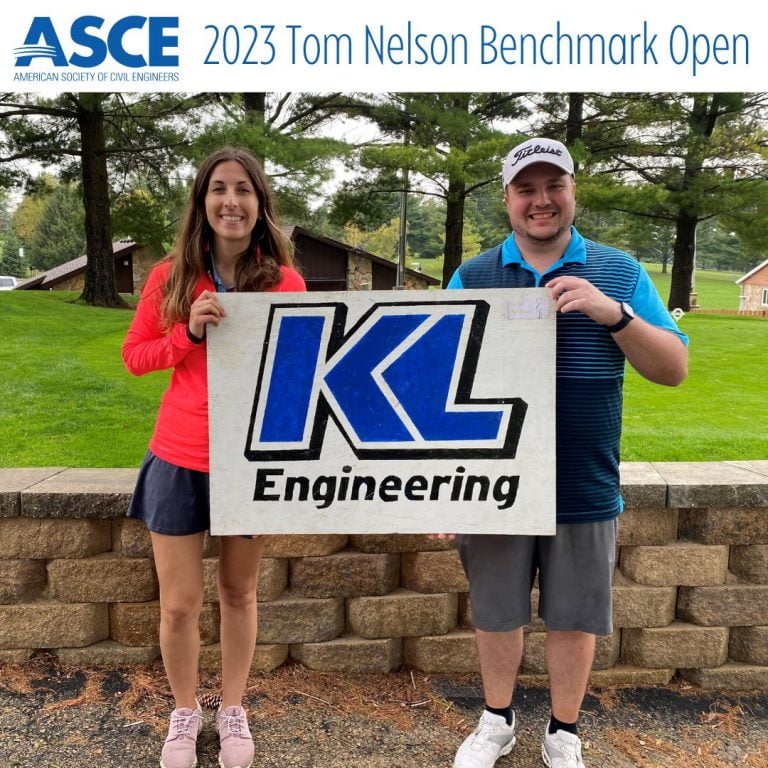 Photo of Arielle Lewien and Jared Baltes holding a KL Engineering sign at the sponsored golf hole for the event, with ASCE logo and event title at top.