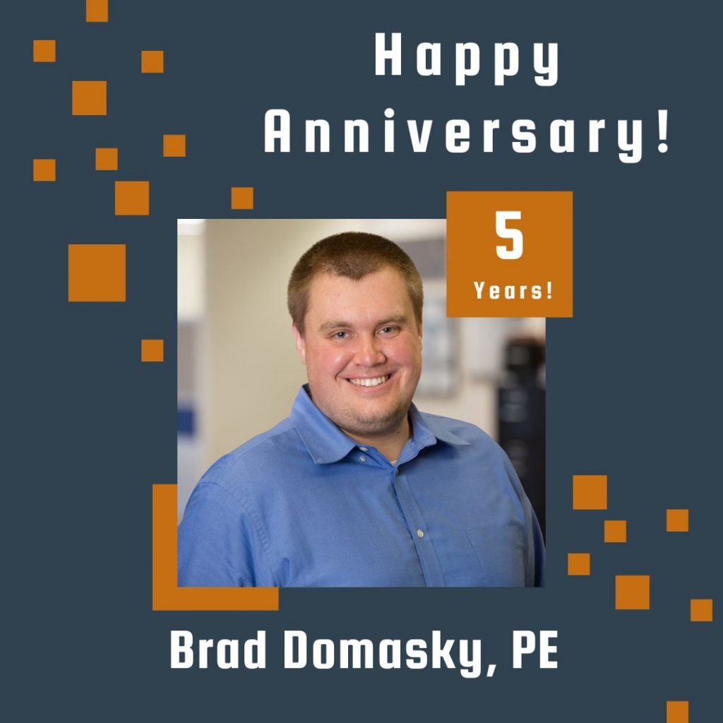 Photo of Brad Domasky framed by a navy background with orange scattered boxes and Happy Anniversary text.