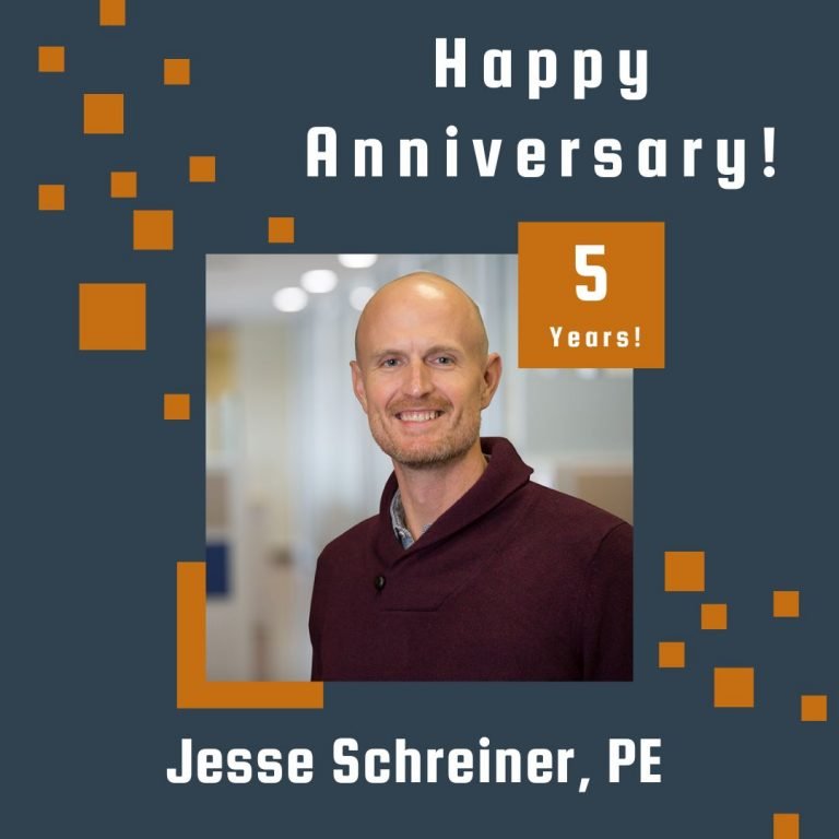 Photo of Jesse Schreiner framed by a navy background with orange scattered boxes and Happy Anniversary text.