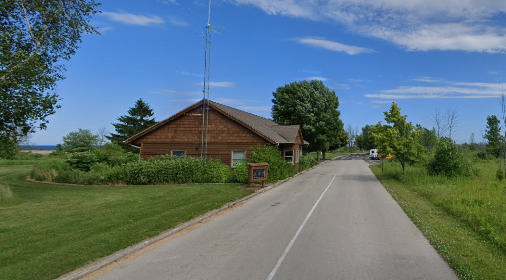Entrance to the Harrington Beach State Park showing registration building.