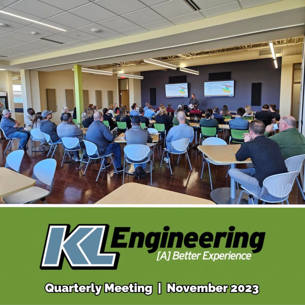 Photo of group facing the presenters in our Madison office during the meeting.