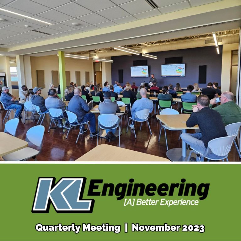 Photo of group facing the presenters in our Madison office during the meeting.