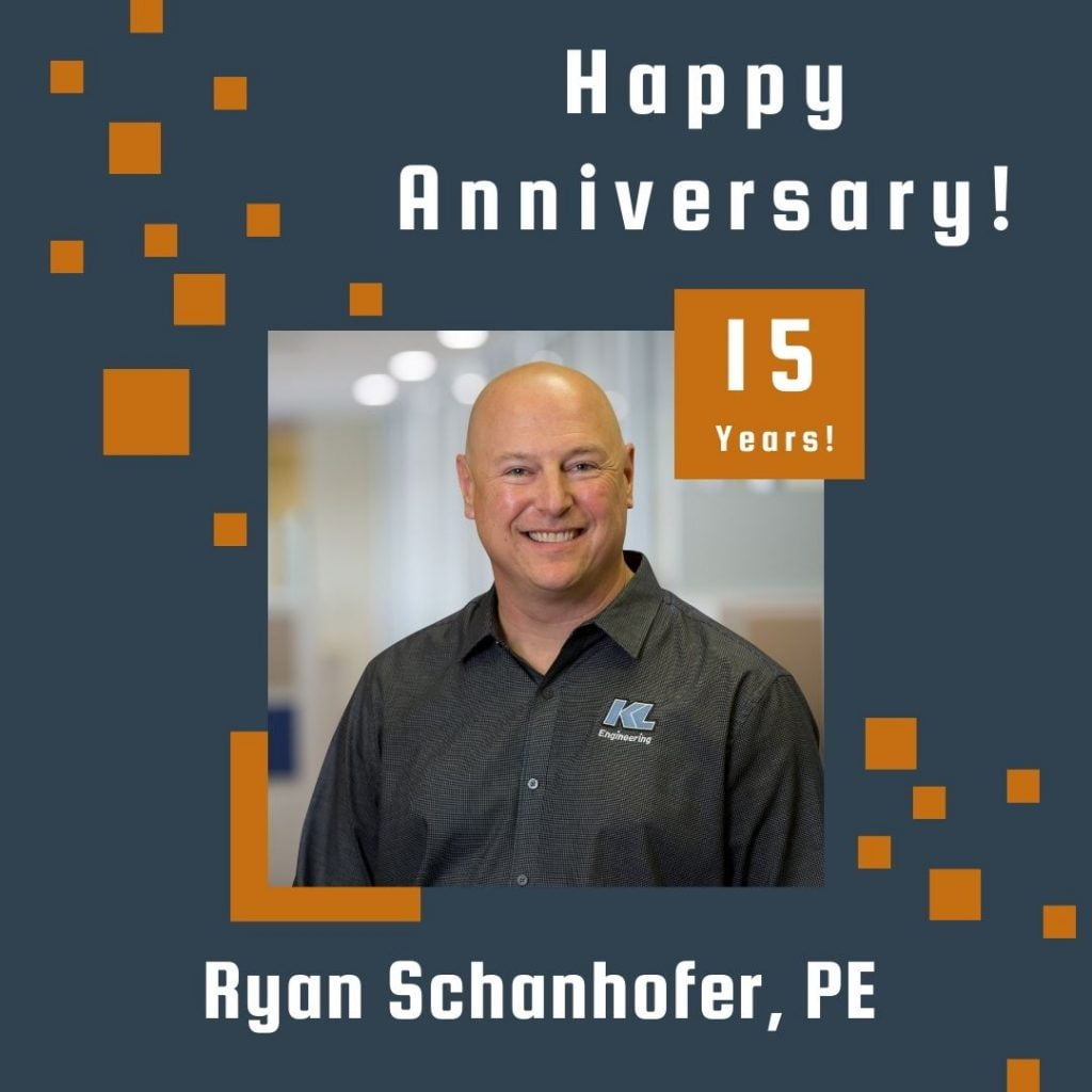 Photo of employee framed by a navy background with orange scattered boxes and Happy Anniversary text.