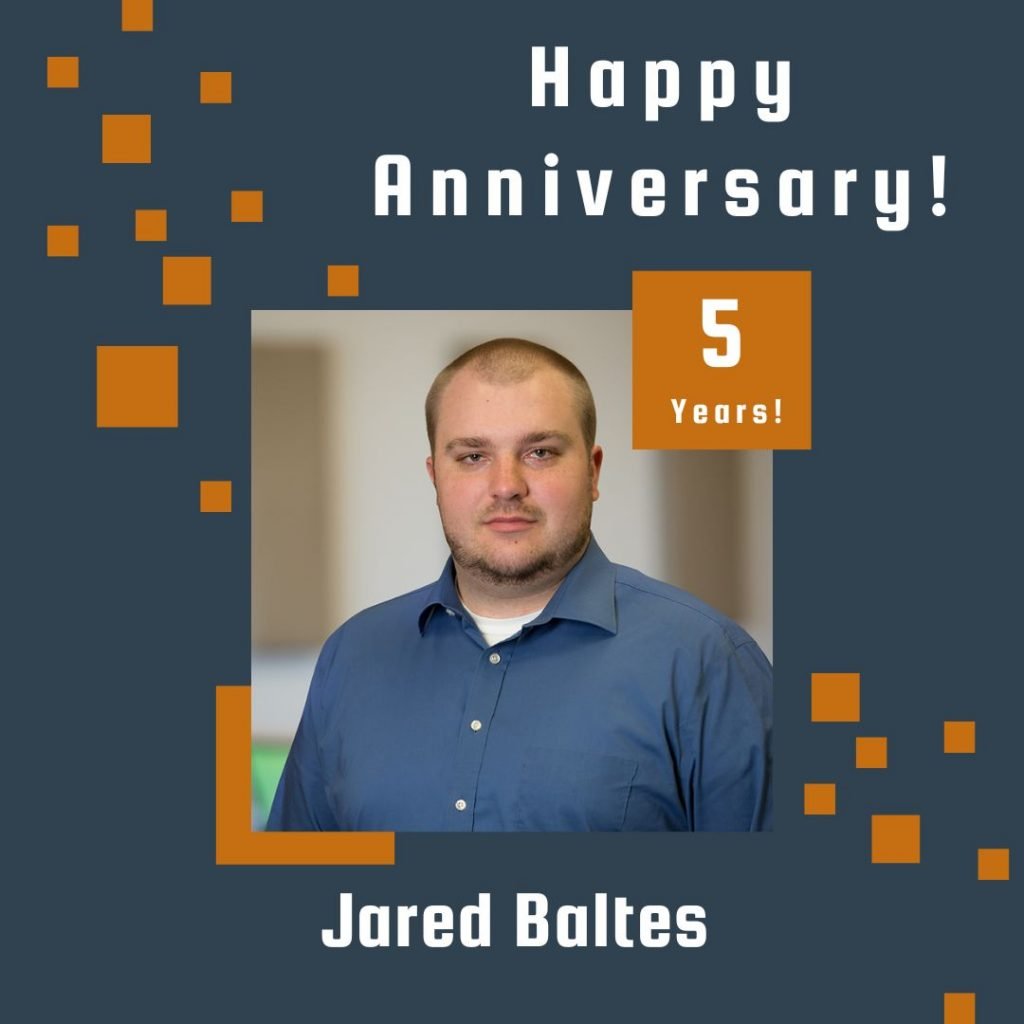Photo of employee framed by a navy background with orange scattered boxes and Happy Anniversary text.