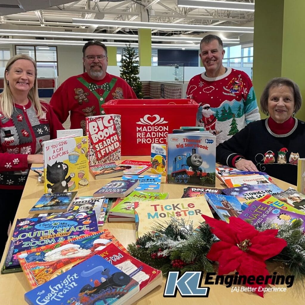 Photo of some of the donors and the donations collected for the Madison Reading Project.