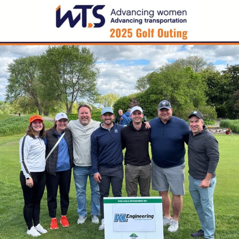 Photo of KL staff mentioned in the post gathered around the KL sponsored golf hole with WTS Advancing Transportation logo and 2025 Golf Outing title.