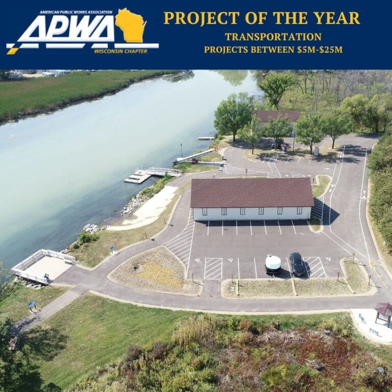 Graphic includes the logo for "APWA Wisconsin Chapter," as well as "Project of the year Transportation, Projects between $5M-25M Dollars" and a photo of the parking area of LYRT and Fish Camp.