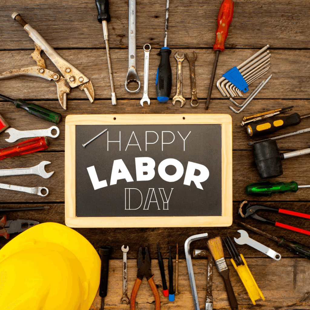 Graphic includes the text "Happy Labor Day" with tools surrounding it on a workbench looking background.