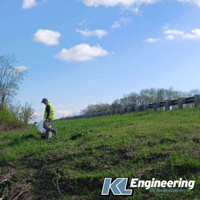 Graphic includes a photo of someone picking up trash in a hi-vis vest on a pretty hillside, with a partly cloudy blue sky.