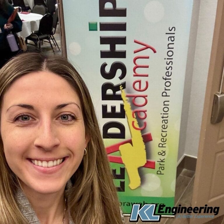 Graphic includes a photo from the conference along with the KL Logo in the bottom corner.