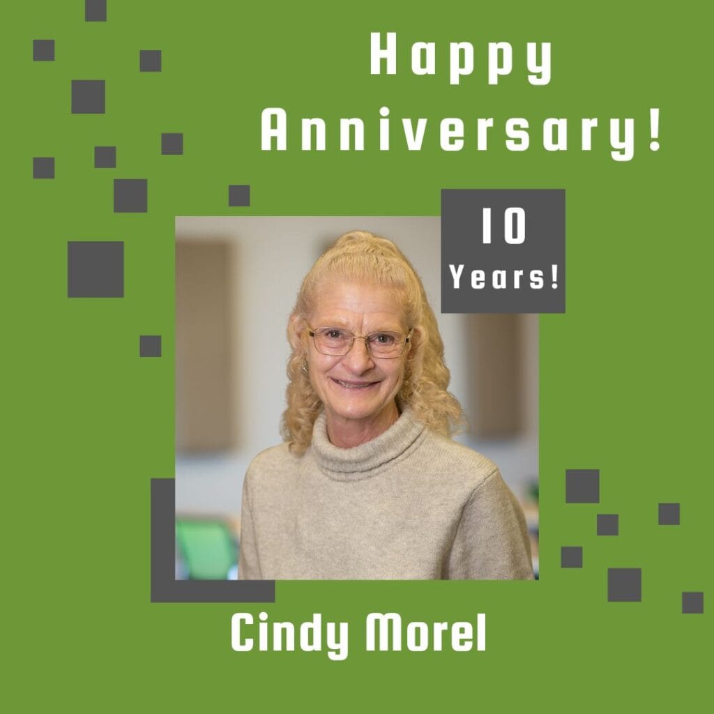 Photo of employee framed by a light green background with gray scattered boxes and Happy Anniversary text.