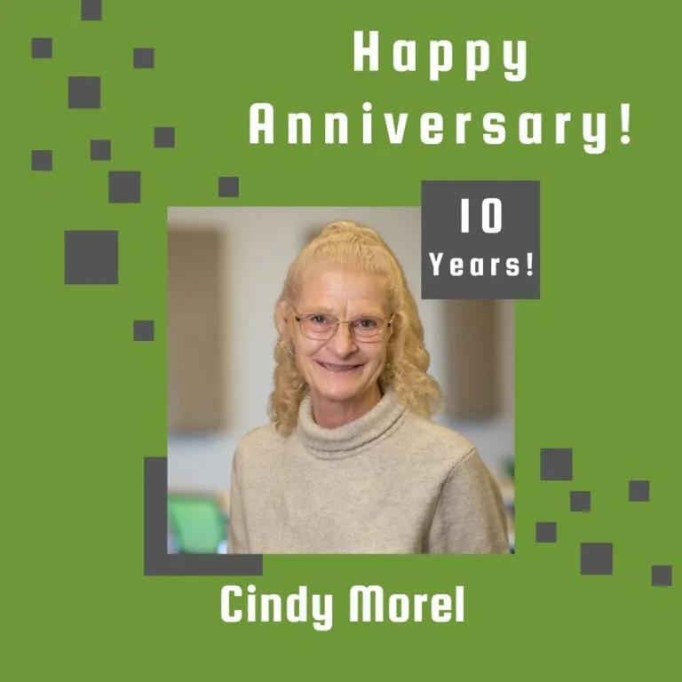 Photo of employee framed by a light green background with gray scattered boxes and Happy Anniversary text.