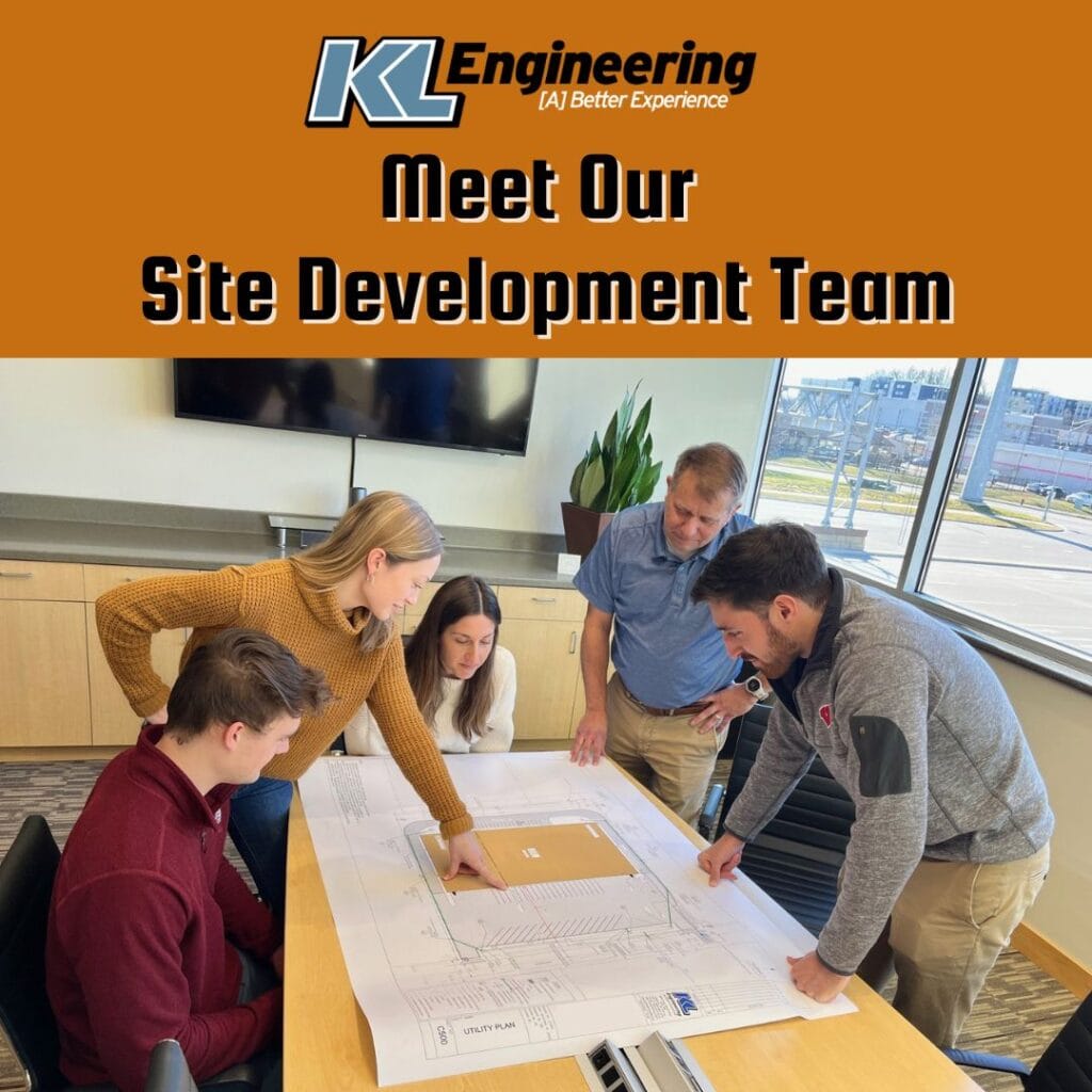 Photo of a team of people looking at site development plans in a beautiful conference room, with KL logo and ‘Meet Our Site Development Team’ title at the top with an orange background.