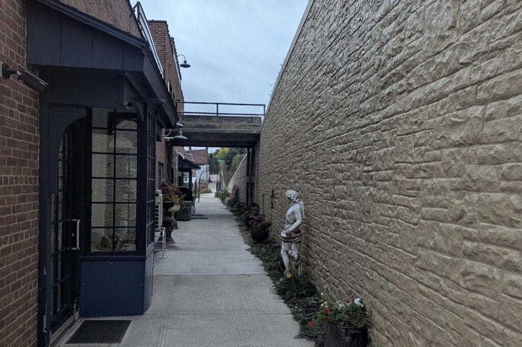 STH 35 Retaining Wall project showing finished wall next to creamery with confined pathway