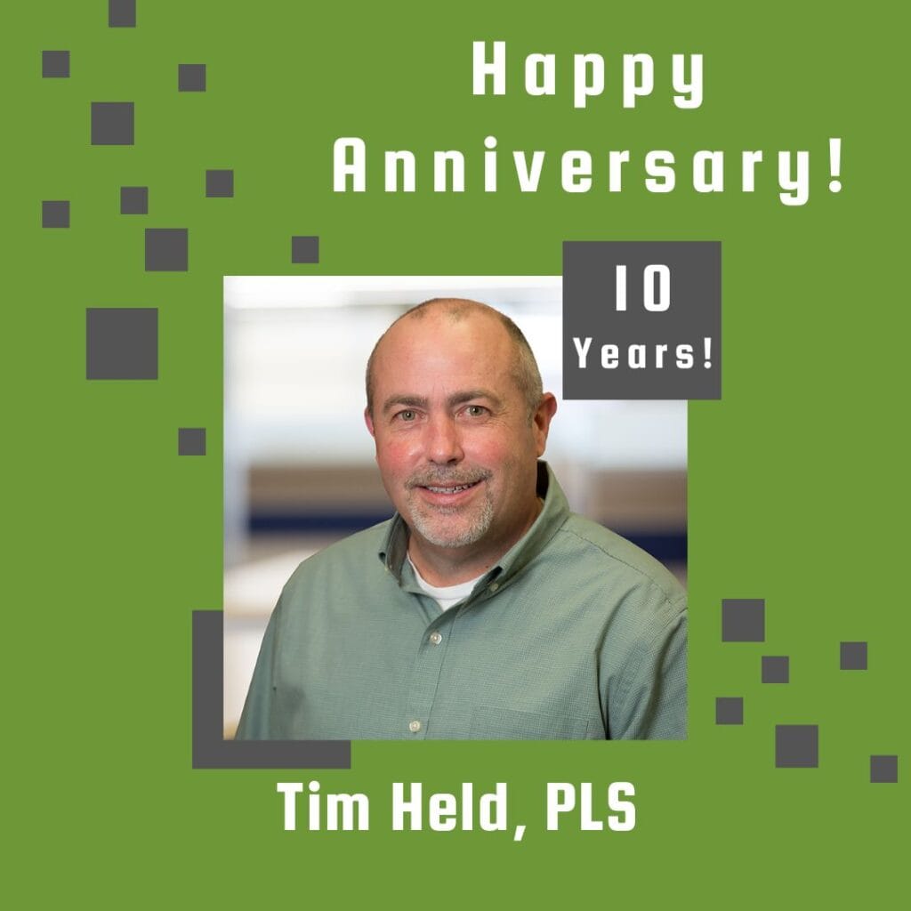 Photo of employee framed by a light green background with gray scattered boxes and Happy Anniversary text.