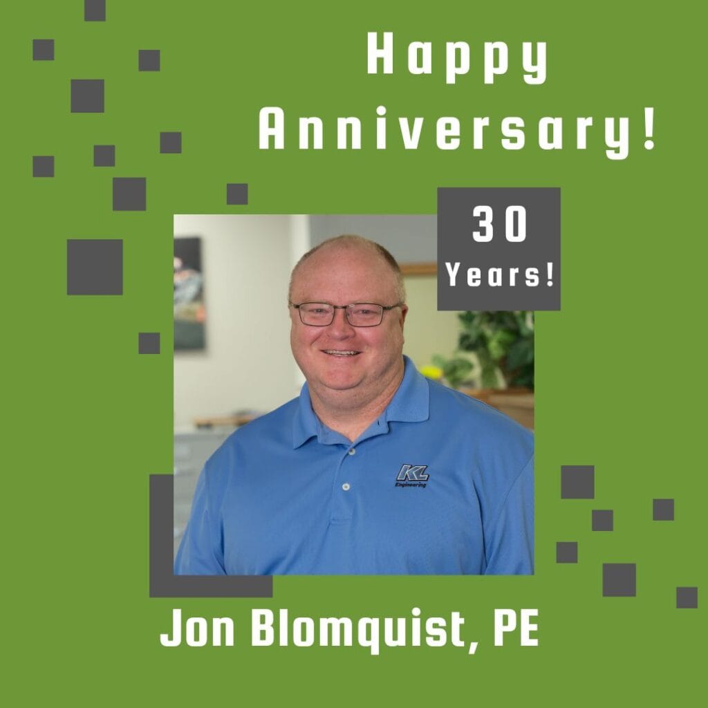 Photo of employee framed by a light green background with gray scattered boxes and Happy Anniversary text.