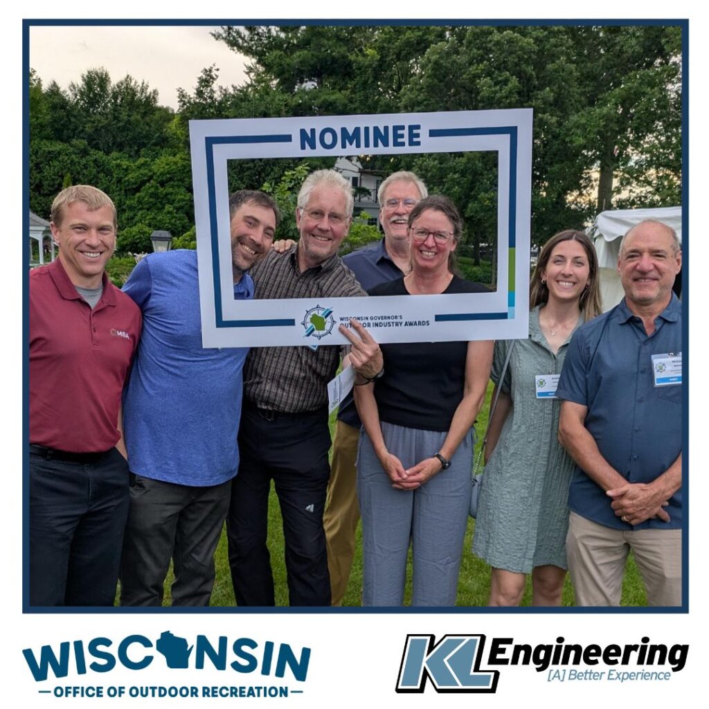 Graphic includes a group photo of the team mentors from the event, in a dark blue frame. Logos for the Wisconsin Governor's Outdoor Industry and KL Engineering are on the bottom.