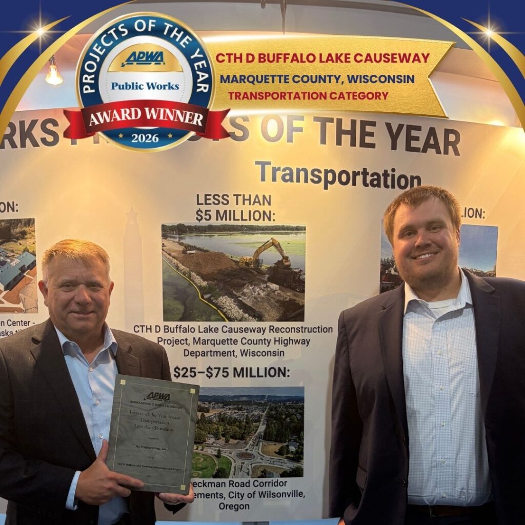 Graphic includes the title of the award with the project name, as well as a photo of two employees holding the award plaque and smiling.